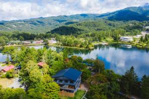 an aerial view of a resort on a lake at Tiny Garden Tateshina in Chino