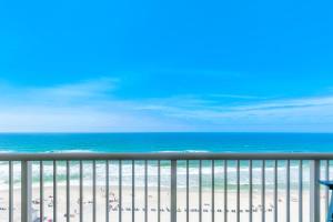 a view of the beach from a balcony at Beachfront Studio #909 at Majestic in Panama City Beach