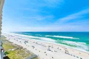 an aerial view of a beach with people and the ocean at Beachfront Studio #909 at Majestic in Panama City Beach