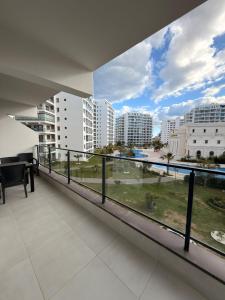 a balcony with a view of a city at Caesar Resort & SPA - Apartments with 1 Bedroom in Iskele