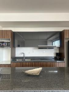a kitchen with a sink and a counter top at Departamento en Yatay Towers in Hércules