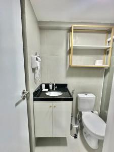 a small bathroom with a sink and a toilet at G5 Beach Flat Intermares 304 in Cabedelo +23 photos