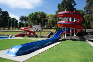 a playground with a water slide in a park at Centro Vacacional Atlixco-Metepec in Atlixco
