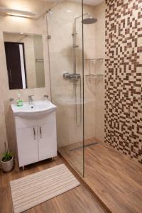 a bathroom with a sink and a shower at Republic Square In Hotel California in Yerevan +26 photos
