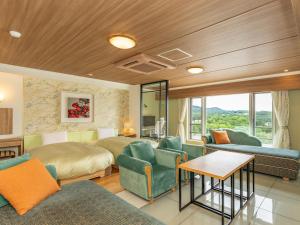 a hotel room with two beds and a living room at Shiretoko Daiichi Hotel in Shari +97 photos