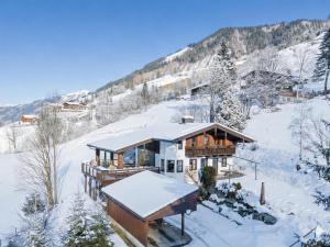 a house on a snow covered hill with snow at Spykerhütte in Rauris