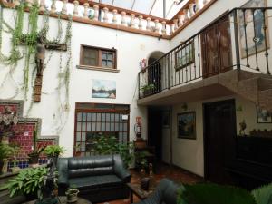 a living room of a house with a balcony at Casa Brusodia in Guadalajara