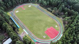 an aerial view of a large field with a race track at Centro Vacacional Malintzi in Guadalupe