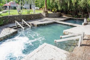 a pool of water with stairs in it at Centro Vacacional Oaxtepec in Oaxtepec