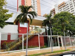 a building with a staircase on the side of it at Play Ilhotas - Centro Teresina in Teresina