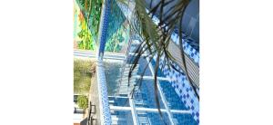 an escalator leading up to a water slide in a building at VangVieng Charming Boutique Hotel in Vang Vieng