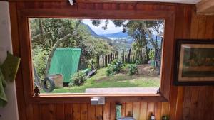 a window in a room with a view of a mountain at Chalet CAJIK Project, tipo Nordico in Cajicá