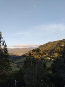a view of a valley from a hill with trees at Chalet CAJIK Project, tipo Nordico in Cajicá +12 photos