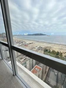 a view of the beach from an office window at Stay Santos 2301 in Santos