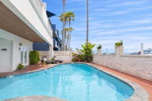 a swimming pool in the middle of a building at Beachwalk Villas in Carlsbad