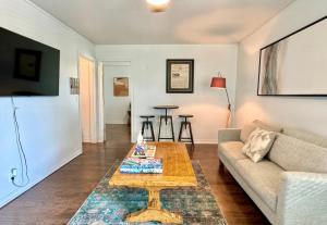 a living room with a couch and a coffee table at 1BR Apt 7 mins Integris Children's Laundry in Oklahoma City