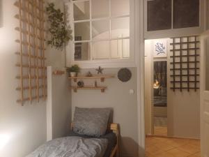 a room with a bed and a window and a door at Ku'damm Taler's Central - Self Check In in Berlin