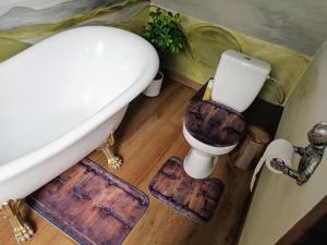 a bathroom with a toilet and a sink at Hraško in Rimavská Sobota +22 photos