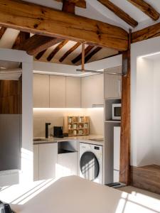 a kitchen with a washer and dryer in it at Luxury Hanok The four beauties seochon in Seoul