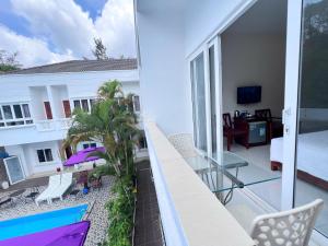a balcony with a view of a living room at Laverder Resort in Phú Quốc