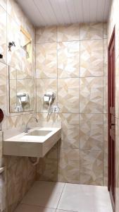 a bathroom with a sink and a shower at Hotel Maracá in Boa Vista +53 photos