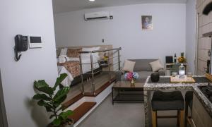 a small living room with a couch and a table at Aparta Hotel Loft 1985 Awaliba in Puerto Gaitán