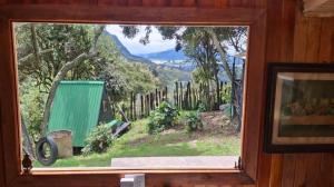 a window with a view of a mountain view at Chalet CAJIK Project, tipo Nordico in Cajicá