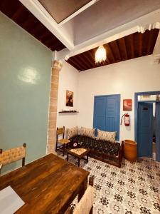 a living room with a couch and a table at essaouira van hostel in Essaouira