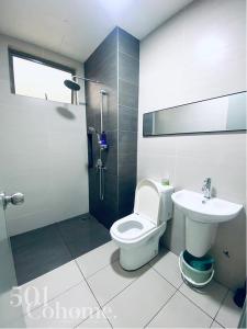 a bathroom with a toilet and a sink at Cyberjaya - Netflix - Disney - Wifi in Cyberjaya +34 photos