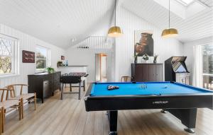 a living room with a pool table in it at Amazing Home In Idestrup With Sauna in Bøtø By