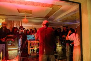 a group of people standing in a room with a mirror at Surf Lodge Tamraght in Tamraght Ouzdar