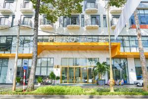 a hotel with a sign on the front of it at Petro House Vung Tau - Block A in Vung Tau