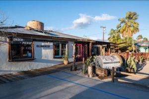 a building with a barrel in front of it at Ramsey 29 in Twentynine Palms +1 photo