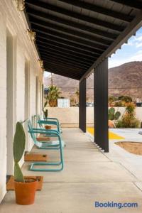 a row of chairs sitting on a porch at Ramsey 29 in Twentynine Palms