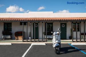 a scooter parked in a parking lot in front of a building at Ramsey 29 in Twentynine Palms