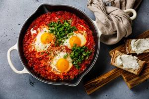 two eggs in a pan with food on a table at Luxus Grand Hotel in Patong Beach +20 photos
