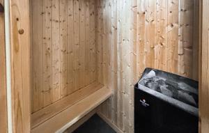 a corner of a room with a wooden wall at Lovely Home In Haderslev With Sauna in Haderslev +22 photos