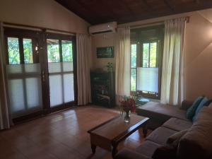a living room with a couch and a coffee table at Mallis Guesthouse in Habaraduwa Central