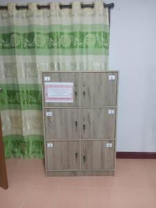 a pair of lockers in front of a curtain at Middle Road Hostel in Nathon Bay +12 photos