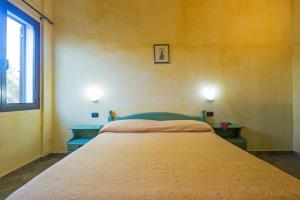 Postel nebo postele na pokoji v ubytování Albergo Residenziale Gli Ontani