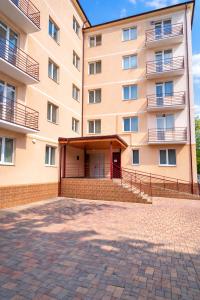 an empty courtyard in front of a building at Best Two Room Apartment in Mukacheve