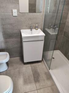 a bathroom with a sink and a shower and a toilet at Quinta Soñada Junin in Junín +19 photos