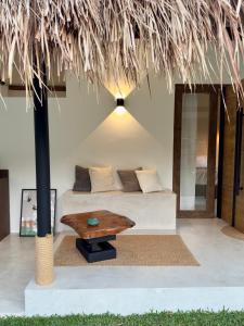 a living room with a couch and a table at Lasa, private villa with private pool in El Nido +35 photos