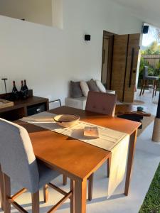 a living room with a table and a couch at Lasa, private villa with private pool in El Nido