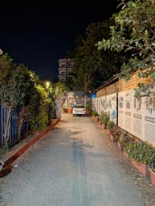 a car parked on the side of a road at night at Hotel Rukmini Residency, Kolhapur in Kolhapur