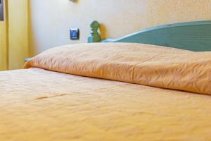 Postel nebo postele na pokoji v ubytování Albergo Residenziale Gli Ontani