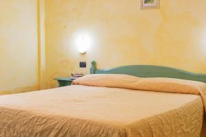 Postel nebo postele na pokoji v ubytování Albergo Residenziale Gli Ontani