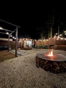 a fire pit in a park at night at SUGEEZ motel in Fujikawaguchiko +15 photos
