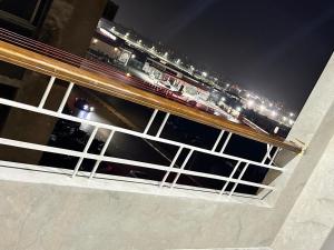 a view of a bridge with a highway at night at Luxury three bedroom duplexSheraton Airport in Cairo