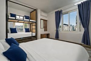 a bedroom with two bunk beds and a window at Miah Ha Noi Hotel - the best choice in Hà Nội Old Quarter in Hanoi